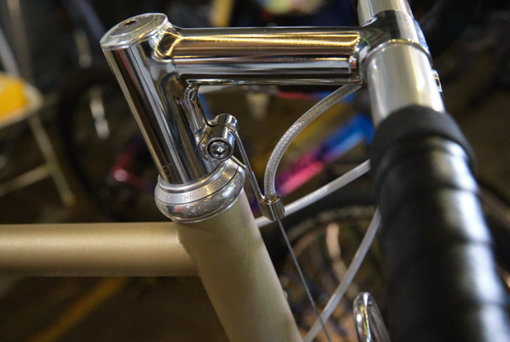 Close-up of a bicycle handlebar with chrome finish